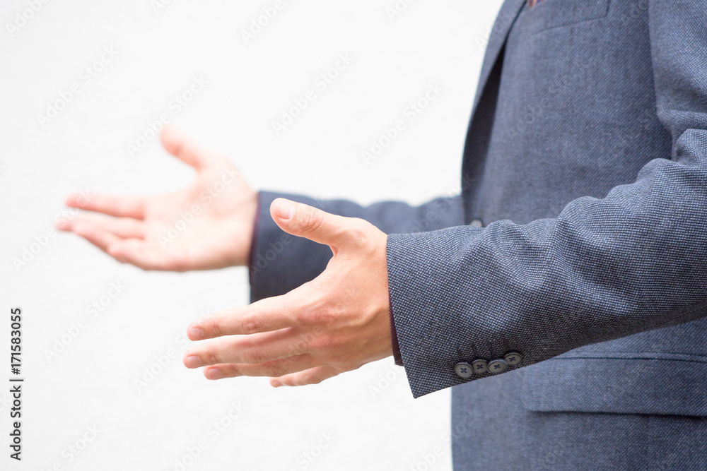 Fototapeta premium Close up hands of a male public speaker while giving a speech. 