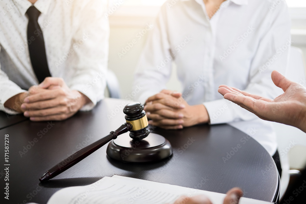 business people and lawyers discussing contract papers sitting at the table. Concepts of law, advice, legal services. business people and lawyers discussing contract papers sitting at the table. Concepts of law, advice, legal services.