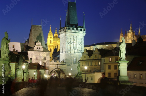 Lesser Tower of Charles Bridge Prague taken at night with the castle in the background