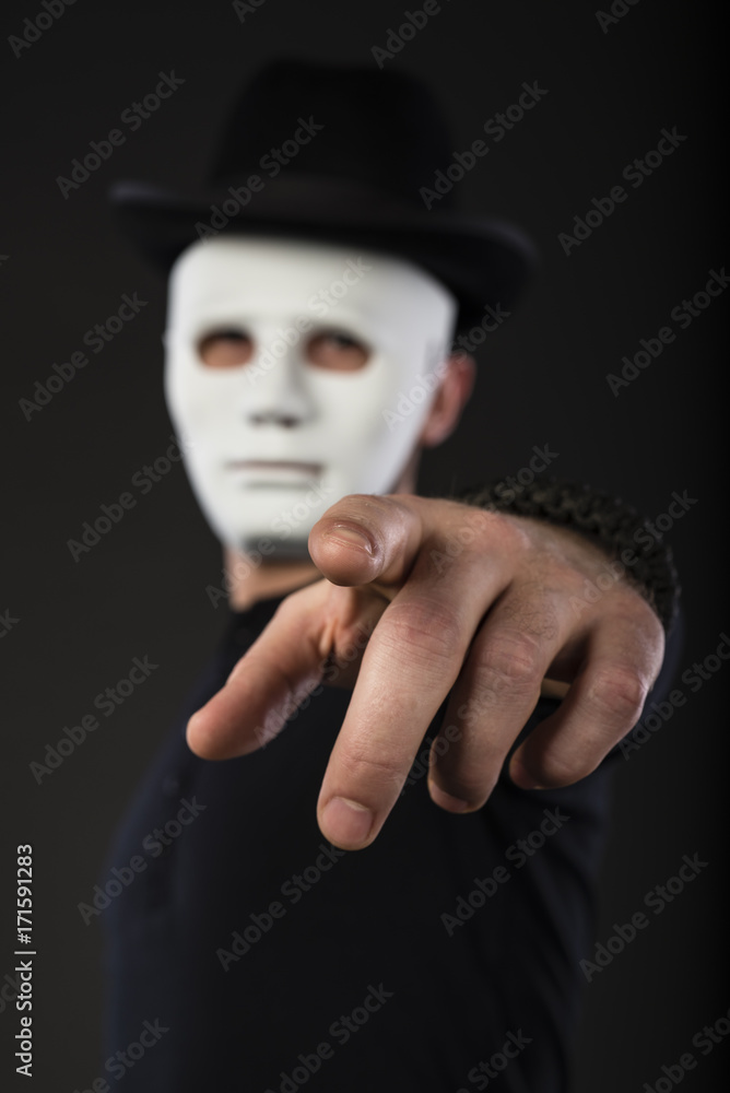 Portrait of Man wearing Bowler Hat and White Mask Portrait of Man wearing Bowler Hat and White Mask