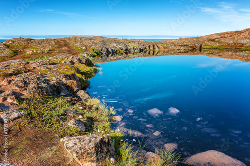 beautiful mountain lake, mirror water surface, blue sky