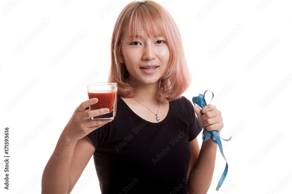 Asian woman with tomato juice and measuring tape. Asian woman with tomato juice and measuring tape.