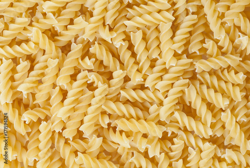 Uncooked fusilli pasta background