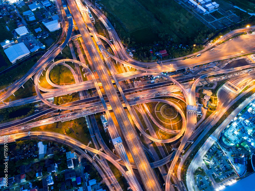 Bangkok Expressway top view, Top view over the highway,expressway and motorway at night, Aerial view interchange of a city, Shot from drone, Expressway is an important infrastructure in Thailand