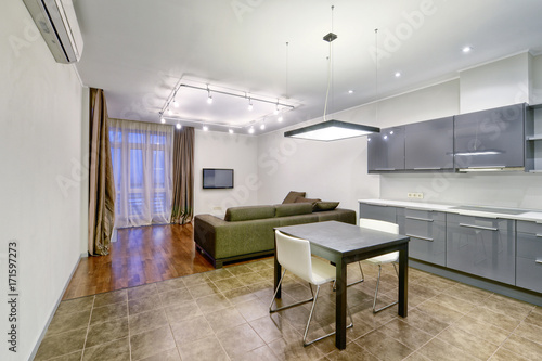 Interior of the kitchen-living room in a modern house. 