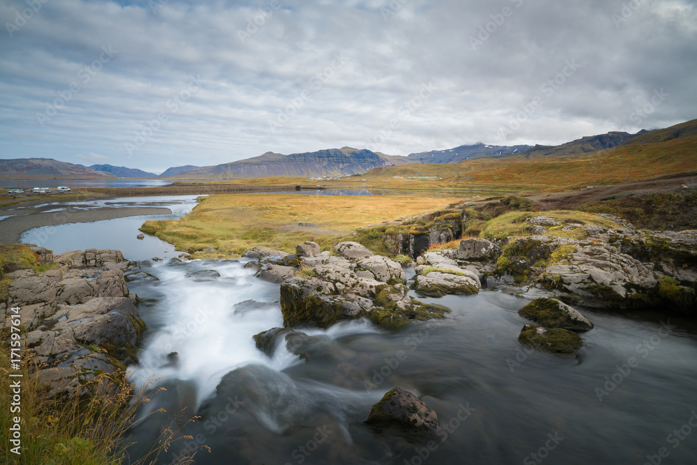 Beautiful of Kirkjufellsfoss waterfall with Kirkjufell mountain in the background on the north, Iceland Beautiful of Kirkjufellsfoss waterfall with Kirkjufell mountain in the background on the north, Iceland