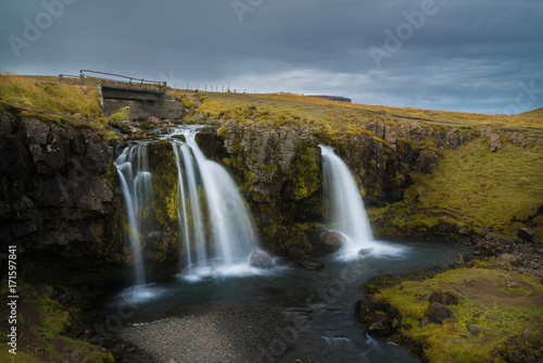 Beautiful of Kirkjufellsfoss waterfall with Kirkjufell mountain in the background on the north  Iceland
