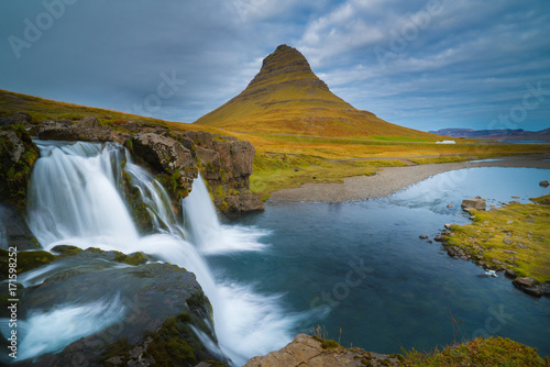 Beautiful of Kirkjufellsfoss waterfall with Kirkjufell mountain in the background on the north, Iceland