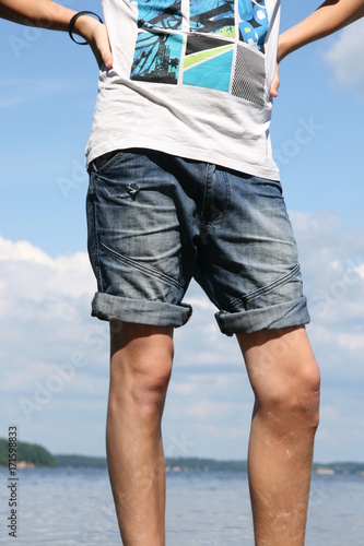 A man in jeans shorts