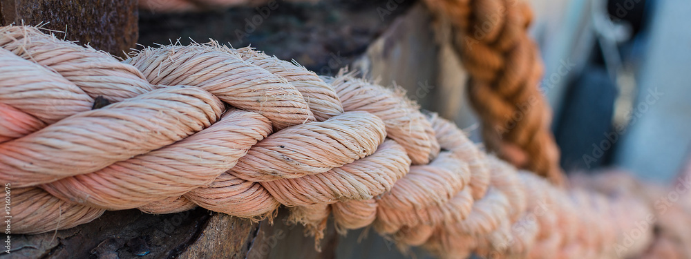 Ropes on Old Rusty Ship Closeup. Old Frayed Boat Rope as a