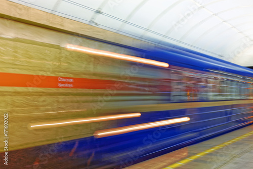 Background of motion blur of speed train in the subway. Underground vehicle dynamic motion