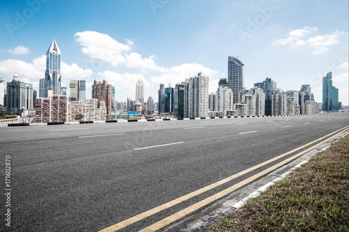 empty asphalt road with cityscape of modern city