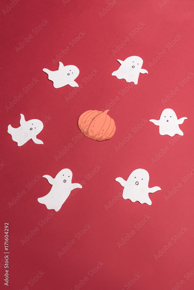 Traditional symbols of ghosts for haloween on red background