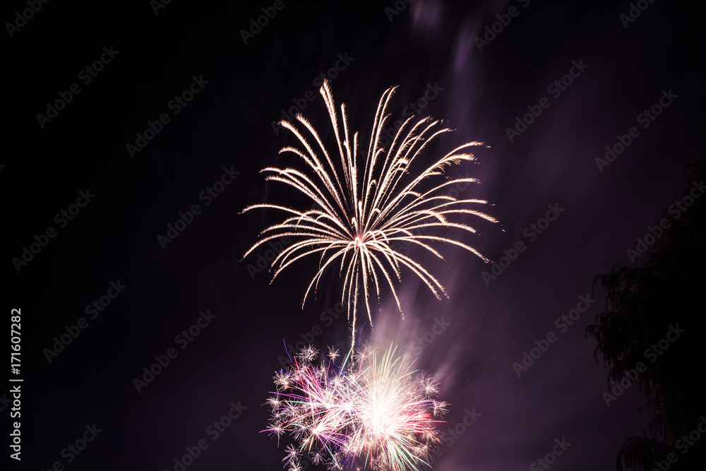 Celebration fireworks over night sky copy space. Celebration colorful fireworks. Beautiful fireworks. Holidays salute.  Independence Day. New Year. Purple firework. Amazing fireworks, fireworks 2017