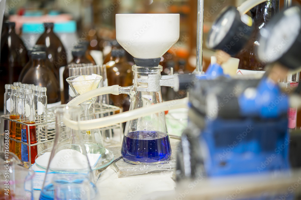 Chemical filtration with Buchner funnel bushings using a vacuum pump