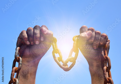 Φωτογραφία Two male hands are raised upwards