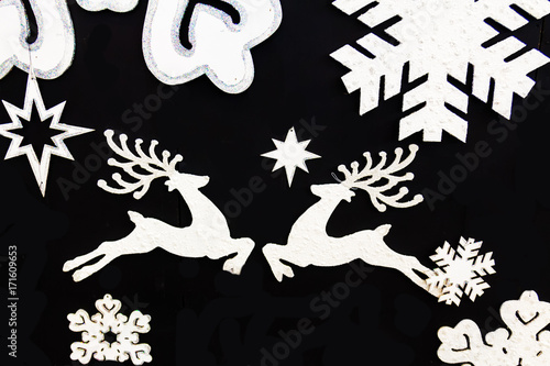 Christmas deer with snowflakes. Isolated on black background