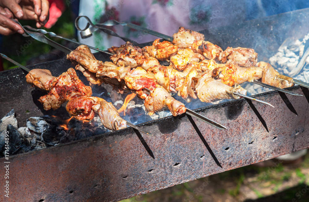 Appetizing hot shish kebab on metal skewers Appetizing hot shish kebab on metal skewers