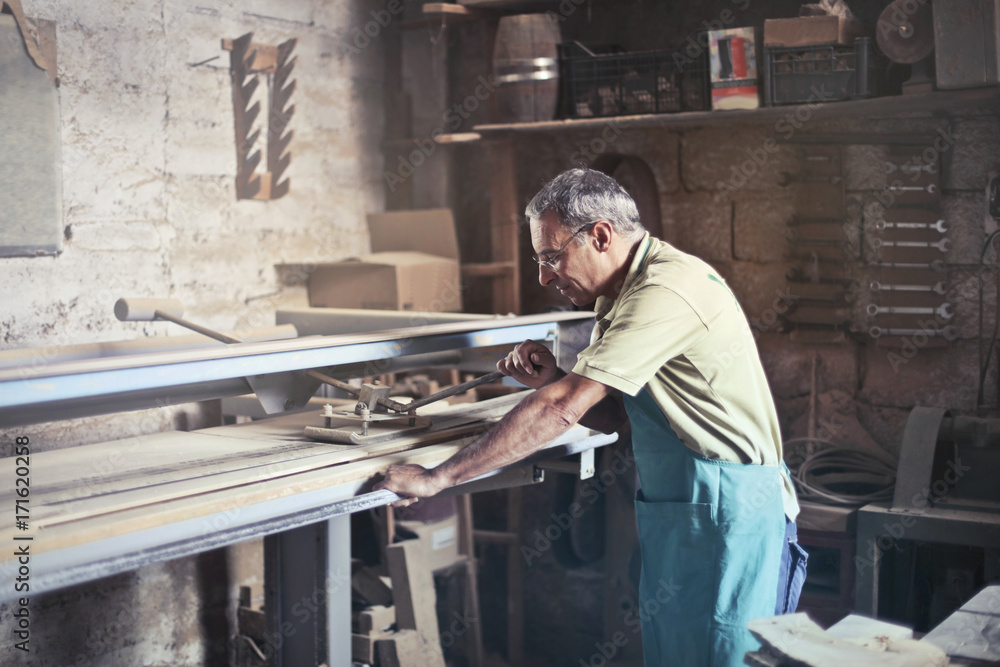 Carpenter cutting wood