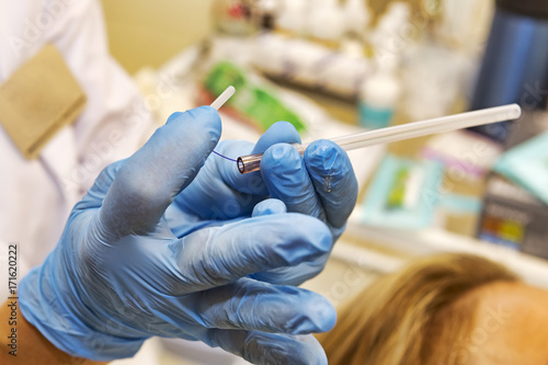 Detail of polylactic acid filament inside the cannula to perform facial lifting procedure named pdo thread	