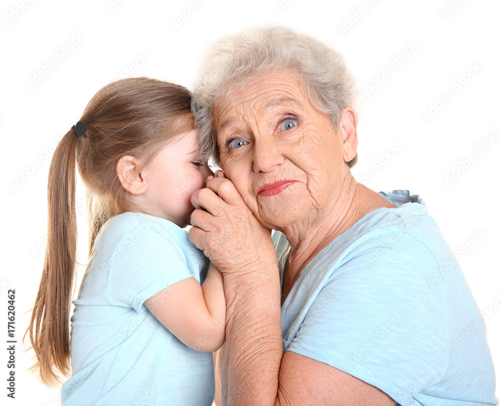 Cute little girl with her grandmother on white background Cute little girl with her grandmother on white background