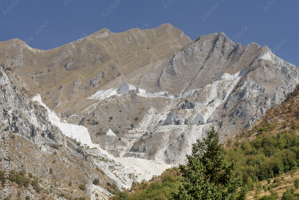 The Apuan Alps and the famous marble quarries viewed from the village of Colonnata, Carrara, Italy, on a sunny day