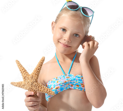 Cute little girl with shell...