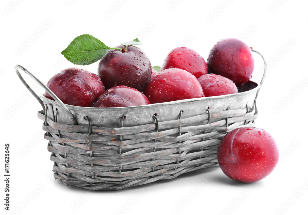 Basket with fresh ripe plums on white background Basket with fresh ripe plums on white background