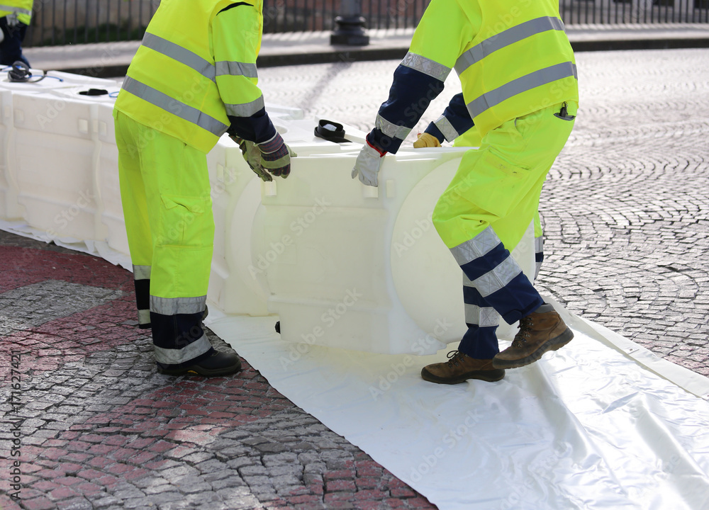 men of civil protection with high visibility clothing during an men of civil protection with high visibility clothing during an