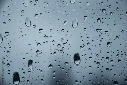 Raindrops on window glass , rainy day