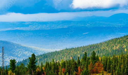 Fototapeta Naklejka Na Ścianę i Meble -  Colourful autumn forest on top of a mountain ridge
