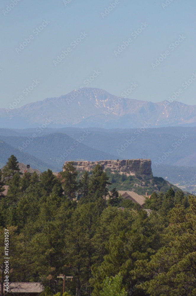 Blue Hue Pike's Peak behind The Castle Rock Colorado