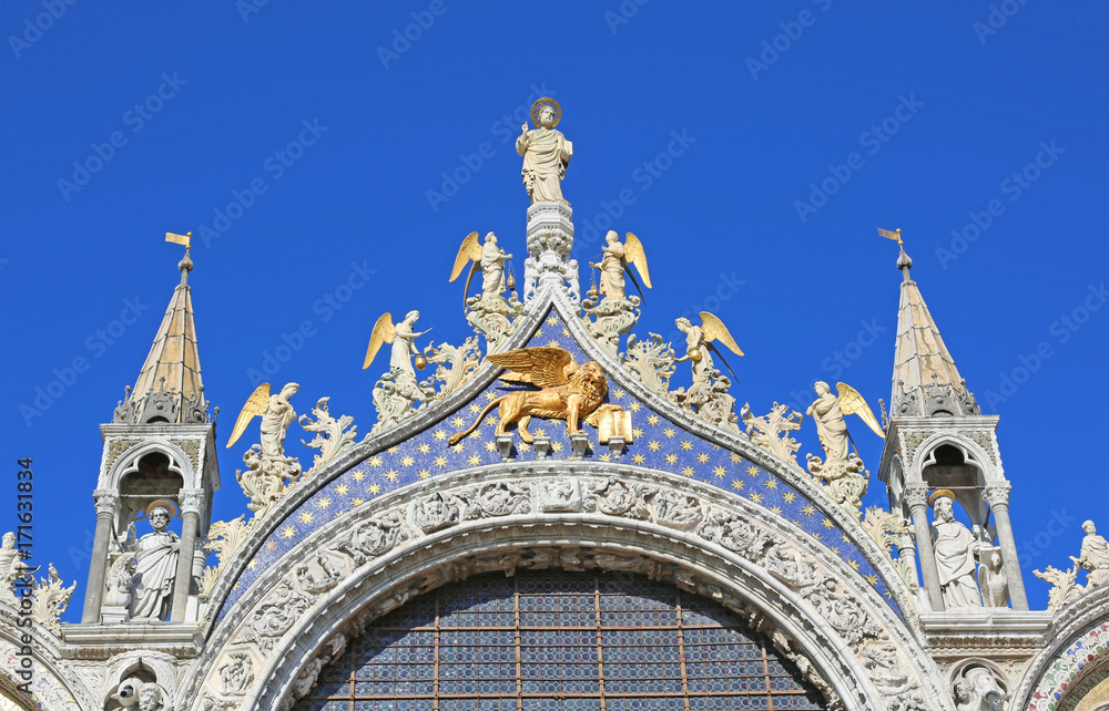 golden winged lion on the Basilica of St. Mark in Venice in Ital