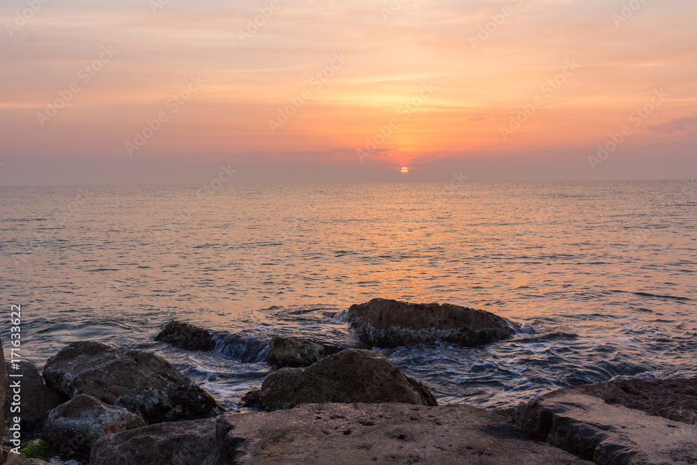 Sunrise over the mediterranean sea at the coast