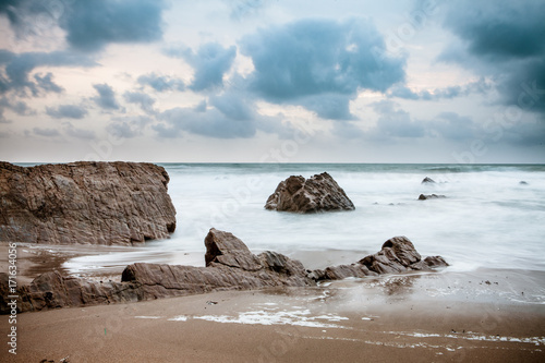 Foto Sunset over Rocks at Widemouth Bay, Cornwall