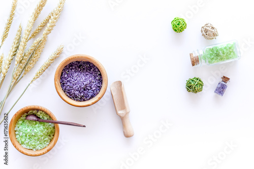 home spa with wheat herbs cosmetic salt for bath on white desk background top view