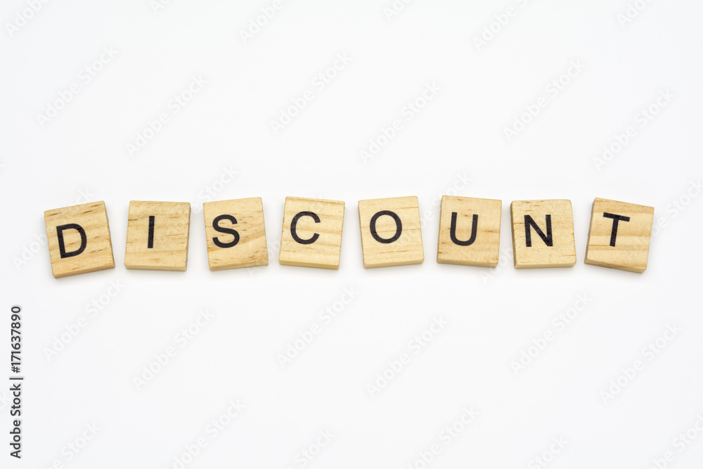 Discount word on scrabble wooden tiles isolated on white background Discount word on scrabble wooden tiles isolated on white background