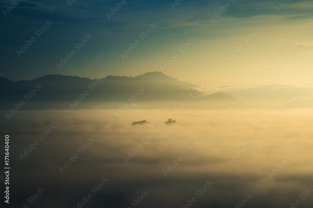 sunrise over fog and mountain in forest sunrise over fog and mountain in forest