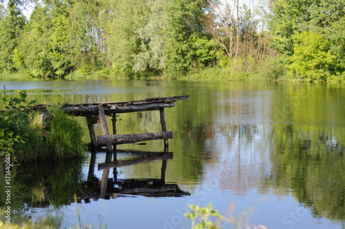 River with a wooden pier in summer in Ukraine