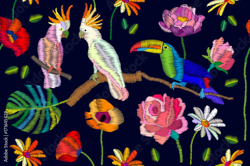 Blooming paradise. Seamless vector pattern with parrots, flowers and palm leaves on black background.