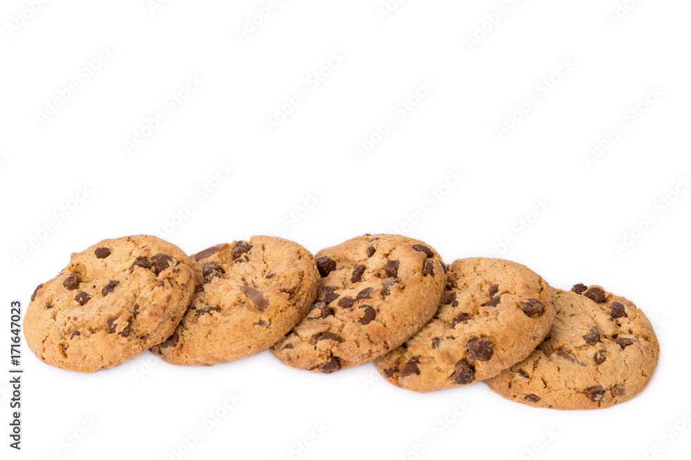 Decorative border line of round cookies with chocolate flakes isolated over the white background.