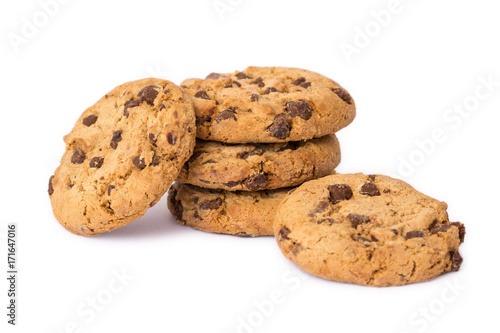Pile of round cookies with the pieces of chocolate isolated over the white background