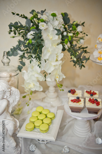 Flowers adorned the table with sweet desserts and cakes 8049.