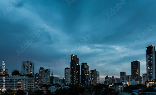 Dramatic cloud sky above city view in blue twilight © takdanai