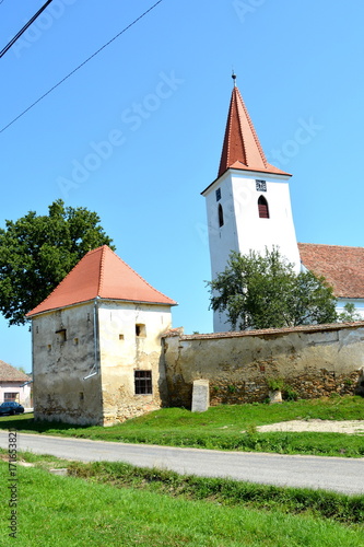 Fortified medieval saxon church in Bruiu - Braller, a commune in Sibiu County, Transylvania, Romania. The settlement was founded by the Saxon colonists in the middle of the 12th century photo