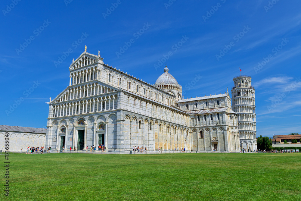View of the Pisa Cathedral and the Leaning Tower in a sunny day in Pisa, Italy