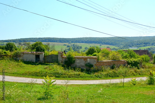 Typical rural landscape and peasant houses in  the village Somartin, Martinsberg, Märtelsberg, Transylvania, Romania. The settlement was founded by the Saxon colonists  photo