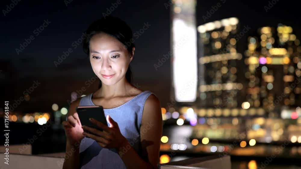 Young woman using smart phone at night Young woman using smart phone at night