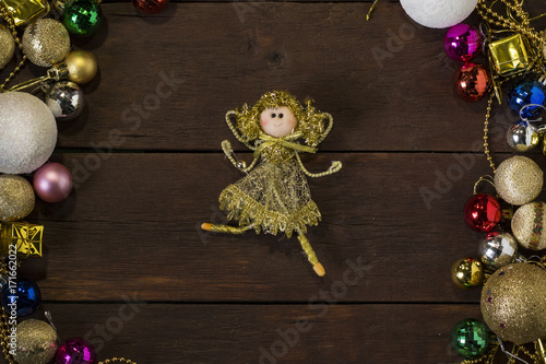 Picture toys in the form of fairies and New Year toys and garlands around.