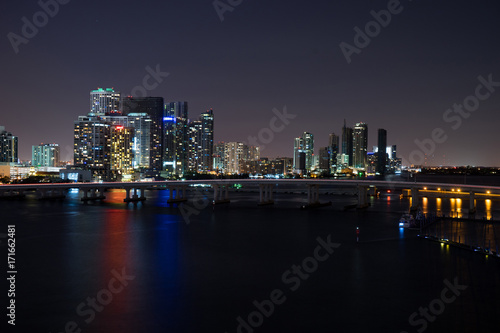 Miami at night. View from atop a glowing building with a bridge © Hladchenko Viktor